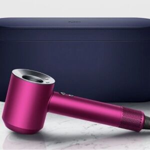 Dyson supersonic hair dryer, like new, with all accessories and case.